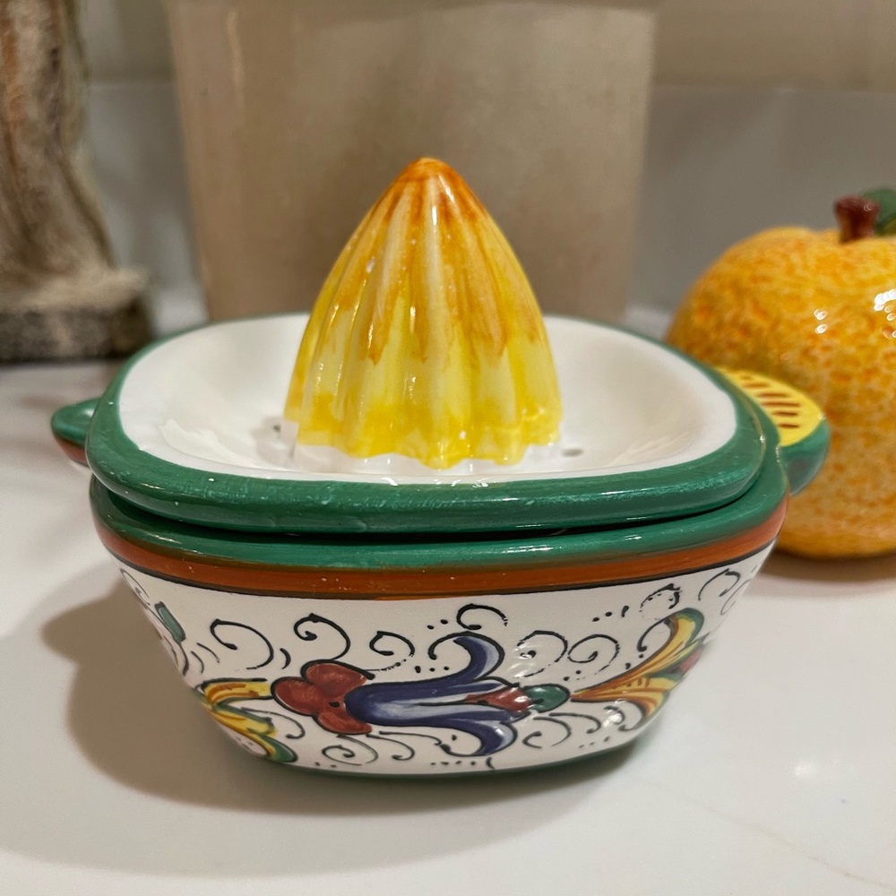hand-painted ceramic citrus juicer, made in Italy 
6” wide
5” tall